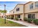 Charming two-story townhome with a traditional stucco exterior and a well-manicured front lawn at 5808 E Brown Rd # 42, Mesa, AZ 85205