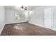 Bright, open-concept living area featuring wood-look floors and plenty of natural light at 5808 E Brown Rd # 42, Mesa, AZ 85205