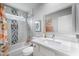 A bright bathroom featuring a shower, and a spacious countertop and sink at 6225 W Mary Jane Ln, Glendale, AZ 85306