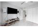 Spacious bedroom featuring a TV, light tile flooring, and bright walls at 6225 W Mary Jane Ln, Glendale, AZ 85306