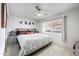A comfortable bedroom with a ceiling fan, window, and modern design at 6225 W Mary Jane Ln, Glendale, AZ 85306