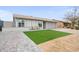 Lovely single-story home showcases a well-maintained lawn, a welcoming covered porch with seating, and an attached garage at 6225 W Mary Jane Ln, Glendale, AZ 85306