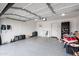 A spacious garage with epoxy flooring and ample space for storage and parking at 6225 W Mary Jane Ln, Glendale, AZ 85306