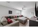 A comfy living room featuring a large sectional and neutral color palette at 6225 W Mary Jane Ln, Glendale, AZ 85306