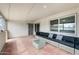 Covered patio featuring an attractive seating area with comfortable furnishings and tiled flooring at 6225 W Mary Jane Ln, Glendale, AZ 85306
