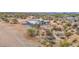 Aerial view showcasing a modern home and its surroundings in the desert landscape at 7261 E Via Dona Rd, Scottsdale, AZ 85266