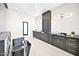 Contemporary bathroom featuring a modern tub, stylish vanity with dark cabinets, and elegant lighting at 7261 E Via Dona Rd, Scottsdale, AZ 85266
