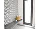 Powder bathroom featuring modern tile, black accents, and natural light at 7261 E Via Dona Rd, Scottsdale, AZ 85266
