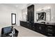 Elegant bathroom featuring modern fixtures, a freestanding tub, and dark cabinetry at 7261 E Via Dona Rd, Scottsdale, AZ 85266