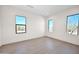 Bright, spacious bedroom with wood floors and multiple windows offering scenic outdoor views at 7261 E Via Dona Rd, Scottsdale, AZ 85266