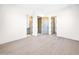 Large room with hardwood floors and multiple doorways offers versatile potential for customization at 7261 E Via Dona Rd, Scottsdale, AZ 85266