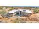Aerial view of a modern home with desert landscaping, walkways, and minimal grass at 7261 E Via Dona Rd, Scottsdale, AZ 85266