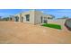 View of modern home's side exterior featuring minimalistic landscaping with synthetic lawn at 7261 E Via Dona Rd, Scottsdale, AZ 85266