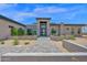 Stunning modern home featuring a meticulously landscaped yard and stylish stone accents at 7261 E Via Dona Rd, Scottsdale, AZ 85266