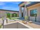 Modern home featuring desert landscaping, stone accents, and a welcoming entrance at 7261 E Via Dona Rd, Scottsdale, AZ 85266