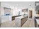 Island kitchen featuring dual waterfall islands, premium appliances, and stylish cabinets at 7261 E Via Dona Rd, Scottsdale, AZ 85266