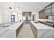 Elegant kitchen with marble countertops, pendant lighting, and top-of-the-line stainless steel appliances at 7261 E Via Dona Rd, Scottsdale, AZ 85266