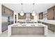 Spacious kitchen featuring marble countertops, custom cabinets, and stainless steel appliances at 7261 E Via Dona Rd, Scottsdale, AZ 85266