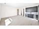 Spacious living room with luxury vinyl plank floors, custom cabinets with wet bar at 7261 E Via Dona Rd, Scottsdale, AZ 85266