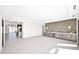 Open living space with a built-in bar area, sleek cabinetry, and natural light at 7261 E Via Dona Rd, Scottsdale, AZ 85266