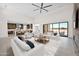 Bright, open-concept living room with modern furnishings, fireplace, and seamless access to the outdoor patio at 7261 E Via Dona Rd, Scottsdale, AZ 85266