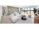Inviting living area with stylish bar, comfortable seating, and expansive windows showcasing desert views at 7261 E Via Dona Rd, Scottsdale, AZ 85266