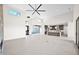 Open-concept living space featuring sleek design, modern ceiling fan, kitchen island, and seamless flow at 7261 E Via Dona Rd, Scottsdale, AZ 85266