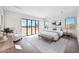 Bright main bedroom featuring hardwood floors, a large window with desert views, and contemporary décor at 7261 E Via Dona Rd, Scottsdale, AZ 85266