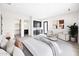 Modern main bedroom boasts a wet bar, walk-in closet, sitting area and ensuite bathroom at 7261 E Via Dona Rd, Scottsdale, AZ 85266