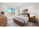 Stylish primary bedroom with a large window offering stunning views and a warm, inviting atmosphere at 7261 E Via Dona Rd, Scottsdale, AZ 85266