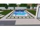 Backyard swimming pool with integrated spa, lounge chairs, and lush landscaping at 7261 E Via Dona Rd, Scottsdale, AZ 85266