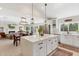 Open floor plan featuring a modern kitchen and living room with a fireplace at 7435 E Corrine Rd, Scottsdale, AZ 85260