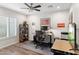 Bright office space with modern ceiling fan, hardwood floors, and a large window at 7435 E Corrine Rd, Scottsdale, AZ 85260