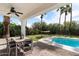 Inviting outdoor patio featuring comfortable seating and a view of the pool and backyard at 7435 E Corrine Rd, Scottsdale, AZ 85260