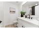 Elegant bathroom with quartz countertop, a modern vanity, and black fixtures at 7717 E Black Rock Rd, Scottsdale, AZ 85255