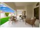 Relaxing covered patio with comfortable seating and a beautiful garden view at 7717 E Black Rock Rd, Scottsdale, AZ 85255