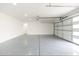 Spacious two-car garage with an epoxy floor and an automatic door opener at 7717 E Black Rock Rd, Scottsdale, AZ 85255