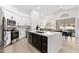 Modern kitchen with white cabinets, stainless steel appliances, and a large island at 7717 E Black Rock Rd, Scottsdale, AZ 85255