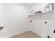 Functional laundry room area with built-in shelving and ample storage space at 7717 E Black Rock Rd, Scottsdale, AZ 85255
