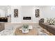 Bright living room with a modern fireplace and decorative artwork creating an inviting atmosphere at 7717 E Black Rock Rd, Scottsdale, AZ 85255