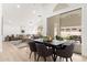 Open-concept living and dining area with modern furnishings and access to an outdoor patio at 7717 E Black Rock Rd, Scottsdale, AZ 85255