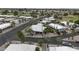 Aerial view of a quiet residential neighborhood featuring well-maintained homes, desert landscaping, and palm trees at 8240 E Pueblo Ave, Mesa, AZ 85208