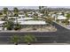 An aerial view of a house with desert landscaping and front yard fountain in a residential neighborhood at 8240 E Pueblo Ave, Mesa, AZ 85208