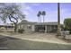 Charming single-story home featuring a covered parking area and desert landscaping in a quiet neighborhood at 8240 E Pueblo Ave, Mesa, AZ 85208