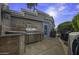 Outdoor kitchen with tile backsplash, stainless steel grill, and convenient access to the house at 8240 E Pueblo Ave, Mesa, AZ 85208