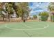 Outdoor basketball court surrounded by mature trees and neighborhood buildings at 8401 N 55Th Ave, Glendale, AZ 85302