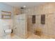 Updated bathroom boasting tile surround, seating, and modern fixtures for a spa-like experience at 8401 N 55Th Ave, Glendale, AZ 85302