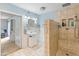 This open concept bathroom features a step in shower and stylish fixtures for convenience at 8401 N 55Th Ave, Glendale, AZ 85302