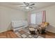 Cozy Bedroom featuring a crib, glider chair, and soft natural lighting, perfect for a  at 8401 N 55Th Ave, Glendale, AZ 85302