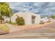 This corner lot boasts a well-maintained landscape with mature trees, shrubs, and gravel for low maintenance living at 8401 N 55Th Ave, Glendale, AZ 85302
